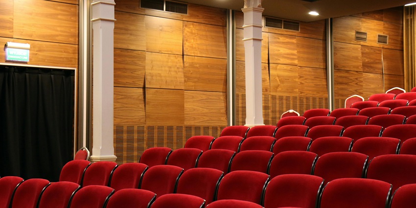 Audience seated in total darkness at Teatro Ciego, where sensory theater performances unfold without visual cues.