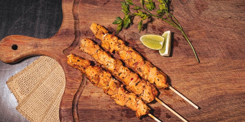 Enjoy delicious skewered kebabs at restaurants near the main destination in Baku.