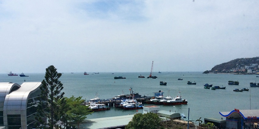 Scenic view of the Vung Tau shoreline, with boats and yachts parked
