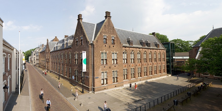 Tourists exploring the exterior of the Centraal Museum, a cultured thing to do in Utrecht.