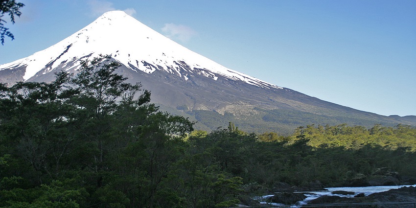 Osorno Volcano in Chile, rising majestically above the landscape under a clear sky.