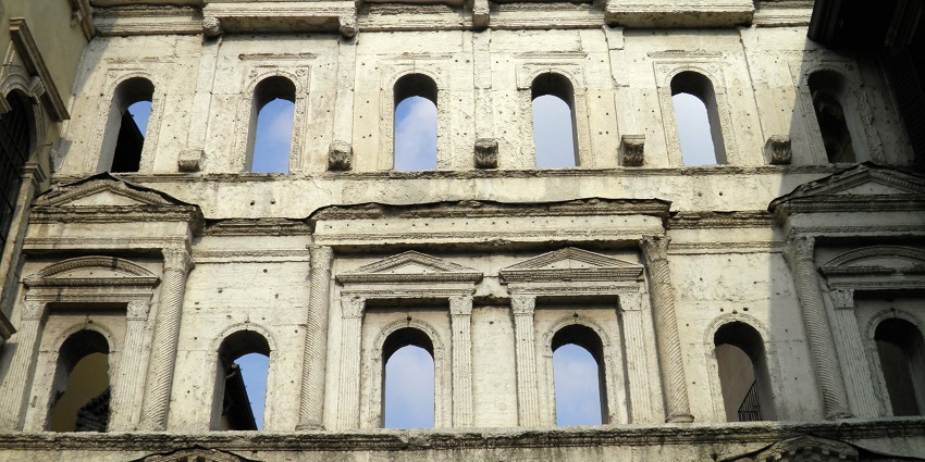 Well-preserved Roman gateway with elegant arches and inscriptions.