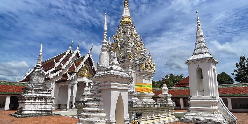 A Buddhist temple with ancient chedi and intricate architecture dating back centuries.