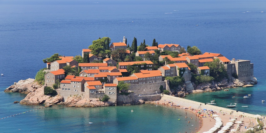 Admire the picturesque islet of Sveti Stefan, a famous luxury resort connected to the mainland by a narrow causeway.