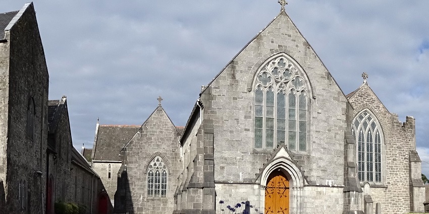 A panoramic view of the exteriors of the Trinitarian Abbey, a catholic church in Adare.