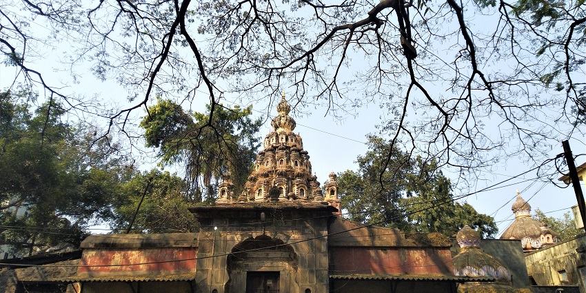A detailed front view of Amruteshwar Temple in Pune, showcasing its ornate architecture