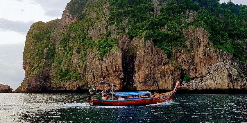 A lively beach destination with nightlife, scenic cliffs, and boat trips to nearby islands