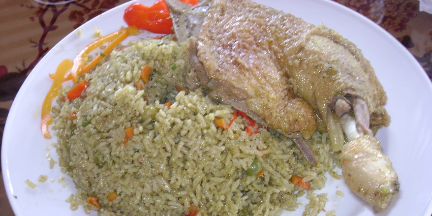 An image of Arroz con Pato, a famous rice and duck dish to eat in Peru.