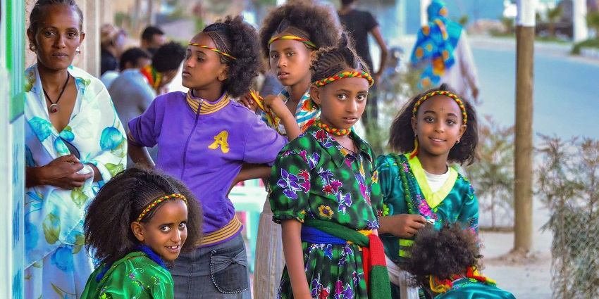 Tigrayan girls in festive clothing celebrating Ashenda with dancing in northern Ethiopia.
