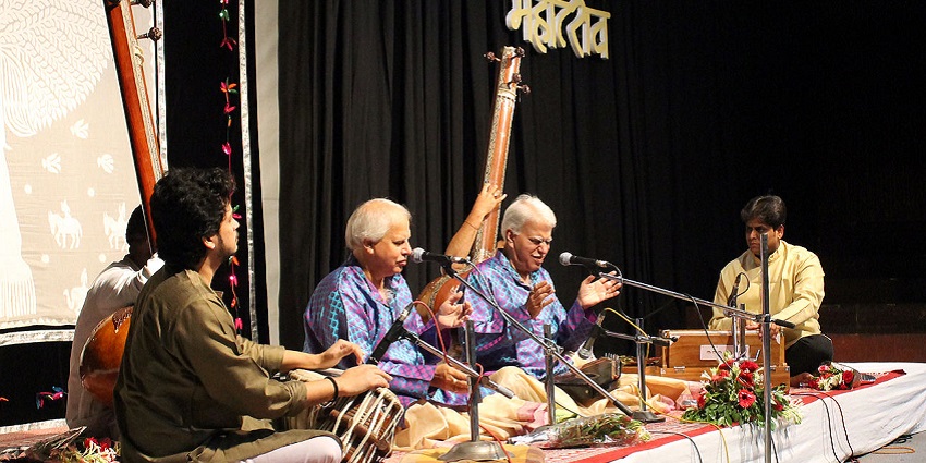 People playing classical instruments at Chennai Music Festival, showcasing live performances.