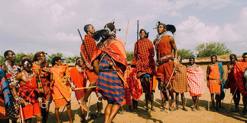 People performing dance rituals as a part of Baliem Valley Festival, one of the top festivals in Indonesia.