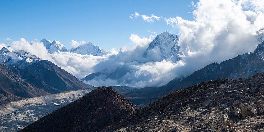 A top view in Bandipur shows hovering clouds with a backdrop of the mighty Himalayas.