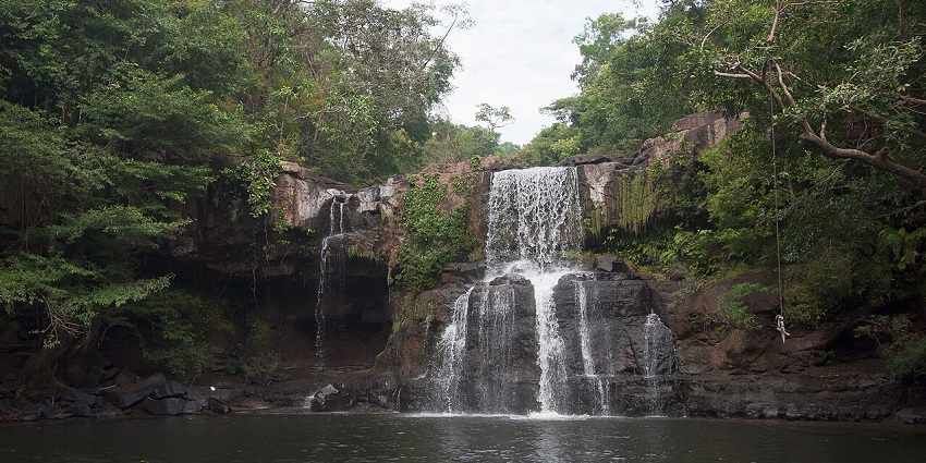 Scenic view of Bang Pae Waterfall surrounded by lush greenery, one of the most beautiful waterfalls in Thailand.