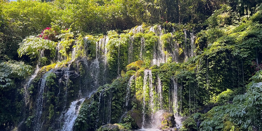 A hot spring with sulfuric waters surrounded by volcanic landscapes and mystical folklore.