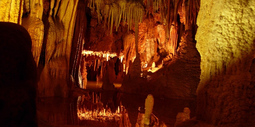An image of the Beredine Cave in Croatia showcasing stunning stalactite formations.