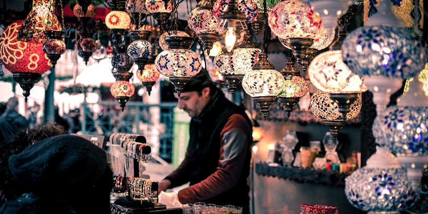 An Image of a vibrant bazaar with bracelets and antique things to buy in Phuket.