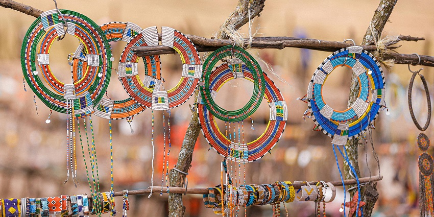 Stunning beaded jewellery hanging on a shop, wire and colourful beads by talented artists