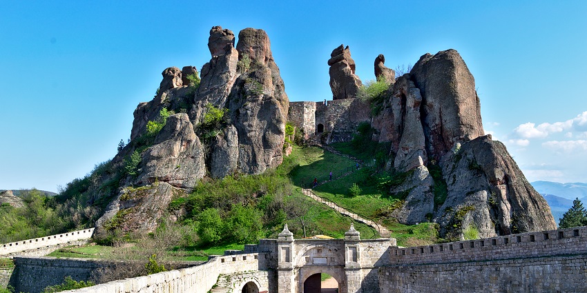 A fortress built into natural rock formations, blending history with geological wonder, among the famous haunted places in Bulgaria.