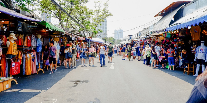 Vibrant market street in Phuket, bustling with local shops, street food, and lively atmosphere