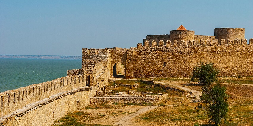 A medieval stone fortress with vast towers, among the most haunted places in Ukraine.