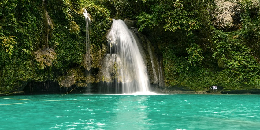 Billy Barquedier Falls with peaceful forest surroundings one of the hidden waterfalls in Belize.