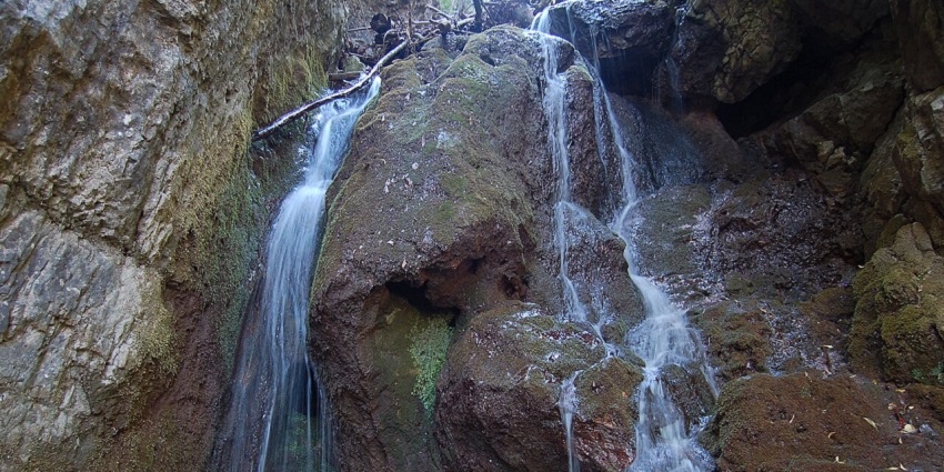 Close view of Borov Kamak Waterfall, Bulgaria with water gushing down steep rocky surface
