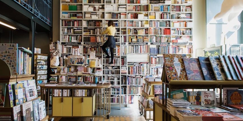 Visitors searching for interesting books at a vintage bookstore, a fun thing to do in SoHo