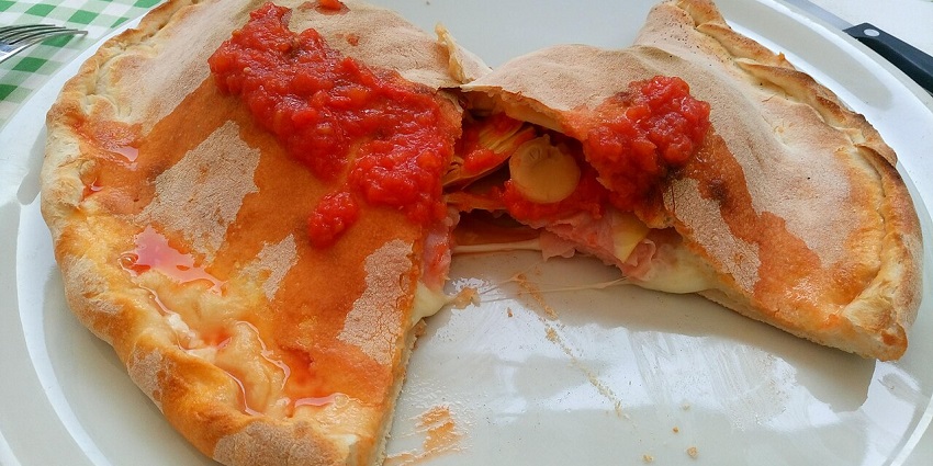 An image showing calzone, one of the best street food in London.