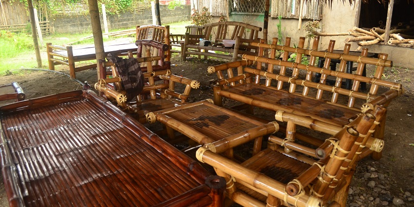 Various bamboo craft products are on display with neat designs and handmade items.