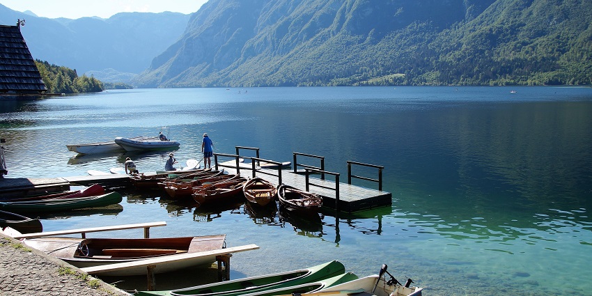 Experience unforgettable canoeing on serene Lake Bohinj amid stunning alpine vistas