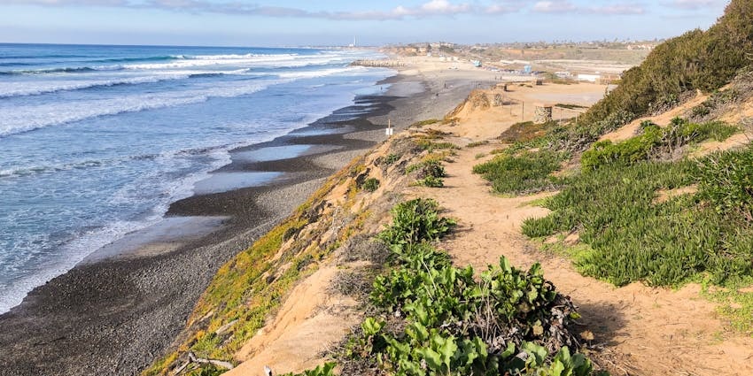 A coastal city known for its flower fields, sandy beaches, and family-friendly attractions like LEGOLAND.