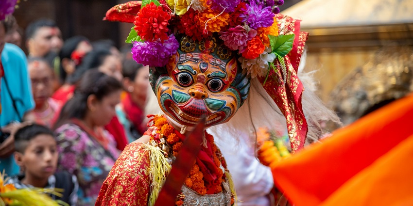 People wearing mask and are celebrating Cali’s Black and White Carnival, one of the best festivals in Colombia.