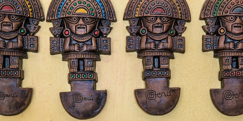 Hand-carved wooden sculpture showcasing detailed craftsmanship and natural texture.