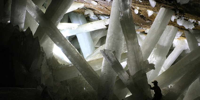 An image of giant crystal formations inside Naica, showcasing unique caves in Mexico.