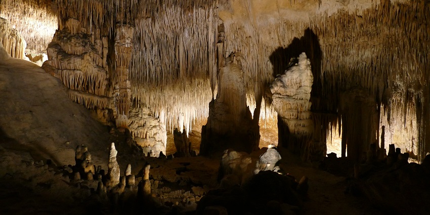 An image of an underground lake inside the Cave of the Drac in France.