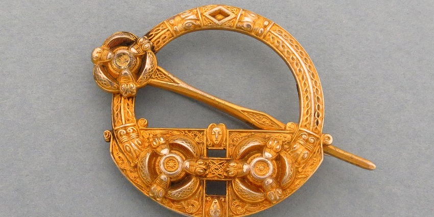 Intricate silver or gold jewellery inspired by ancient Celtic knots, spirals, and mythological designs.