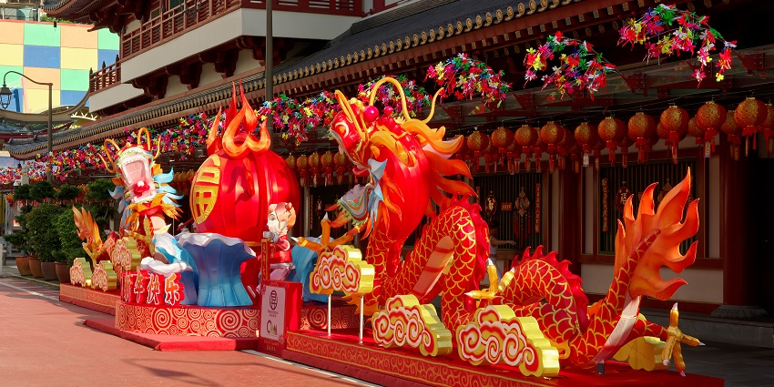 Colourful dragon lantern display outside a temple in Singapore during Chinese New Year.