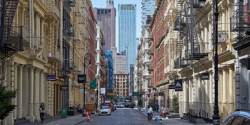 A woman exploring the famous Greene Street, among recommended things to do in SoHo.