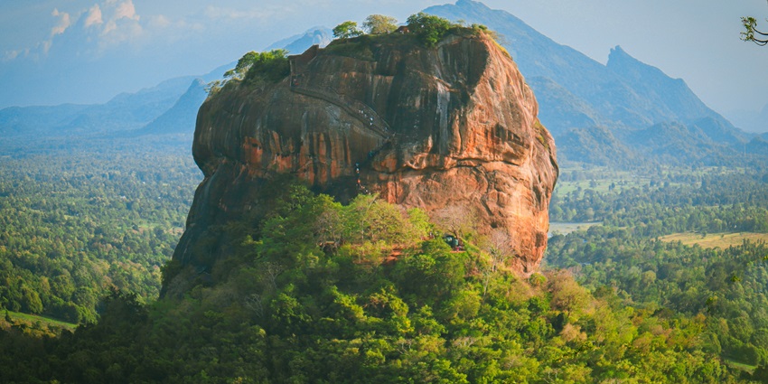 Ascend ancient steps to the top of this UNESCO-listed rock, offering sweeping jungle.