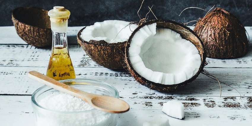 Image of coconut oil and its products arranged on a table, one of the top things to buy in Phuket.