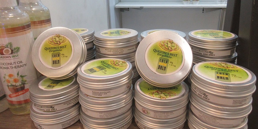 Jars and bottles filled with coconut oil are neatly displayed on shelves at a health store in Pattaya.