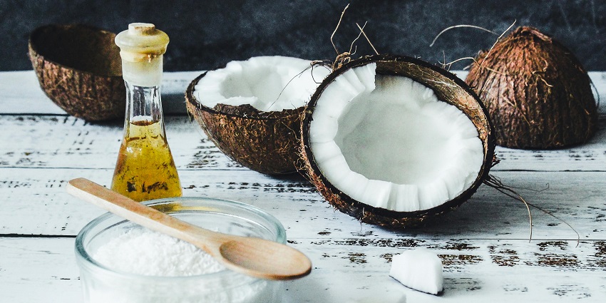 An image of coconut oil bottles and sets showcasing some of the things to buy in Thailand.
