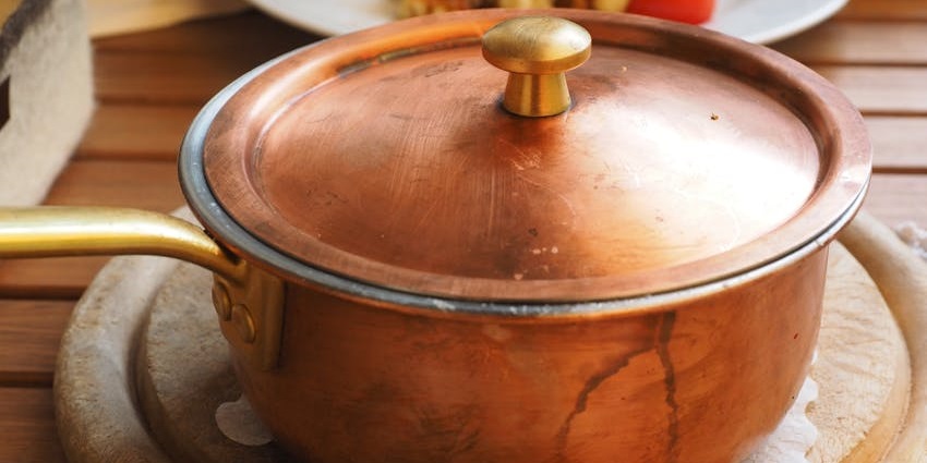 An image showing a view of a utensil resembling traditional Turkish copperware.