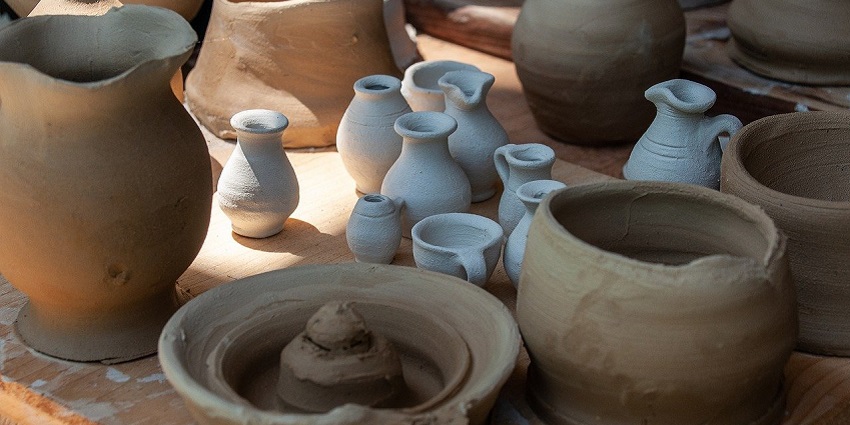 An image of hand-crafted jugs resembling Cotswold pottery, a traditional thing to buy in UK.