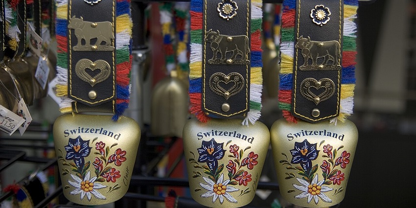 An image showing a view of decorated Swiss cowbells hanging in a shop in Switzerland