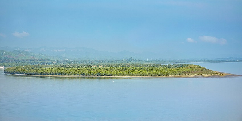 The incredible glimpse of an island at Cox Bazar in Bangladesh surrounded by hills at a distance.