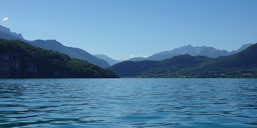 A scenic view from a boat cruising on Lake Annecy, one of the best things to do in annecy france.