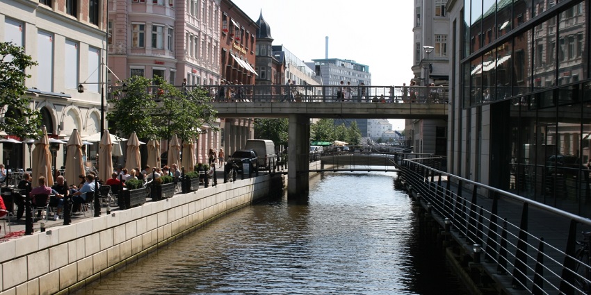 Fiskergade Street in Aarhus with charming and colourful buildings along the Aarhus River.