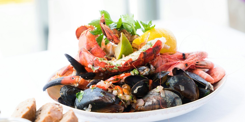 An image of a seafood Crudo plate at DA Vittorio, one should travel once for food in Italy.