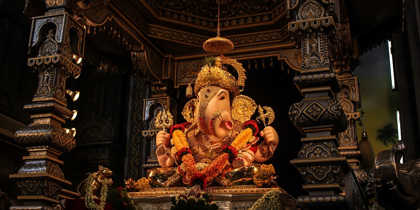 Image of Dagdusheth Ganpati, Pune inside with Ganesh ji statue vibrant colour
